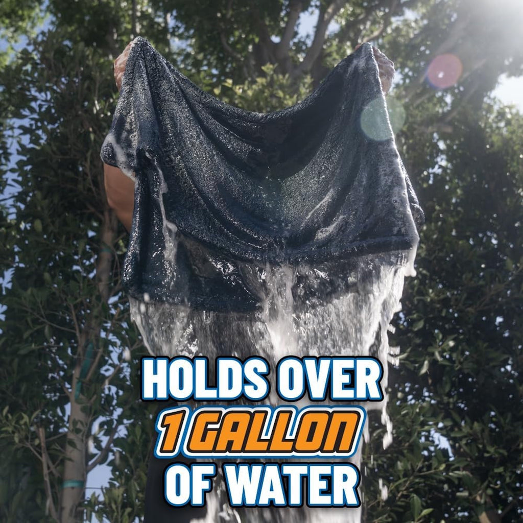 Megalodon Twisted Loop Microfiber Drying Towel wringing out water outdoors - holds over 1 gallon of water