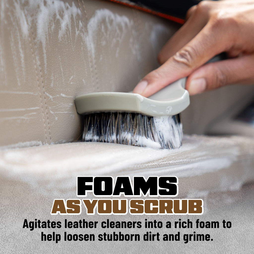 Nifty Leather Cleaning Brush scrubbing leather car seat to rich foam - foams as you scrub, agitates leather cleaners to loosen stubborn dirt and grime