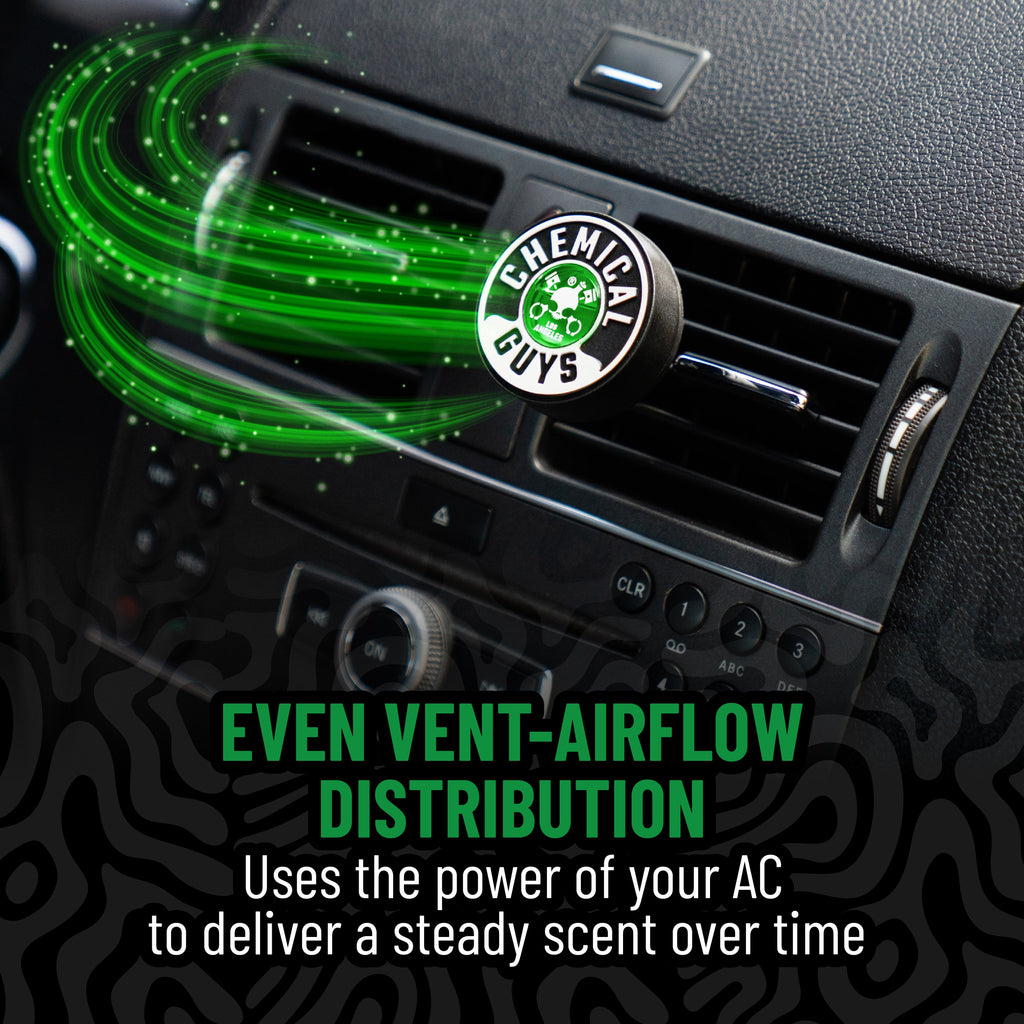 A round black and white Chemical Guys air freshener plug inserted into a car air vent, with bright green graphic airflow lines and text reading 'EVEN VENT-AIRFLOW DISTRIBUTION' and 'Uses the power of your AC to deliver a steady scent over time.'.