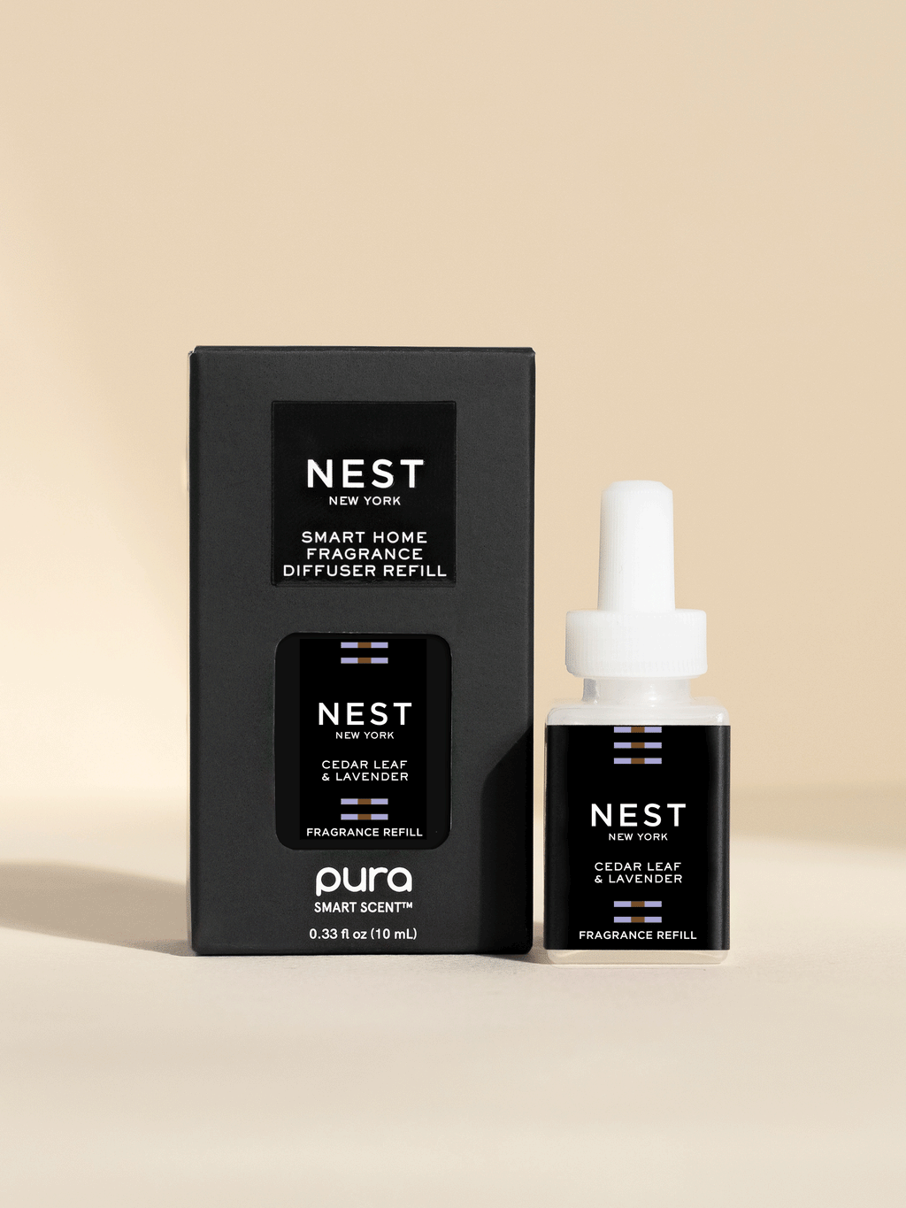 NEST New York Cedar Leaf and Lavender fragrance vial and packaging on a beige background