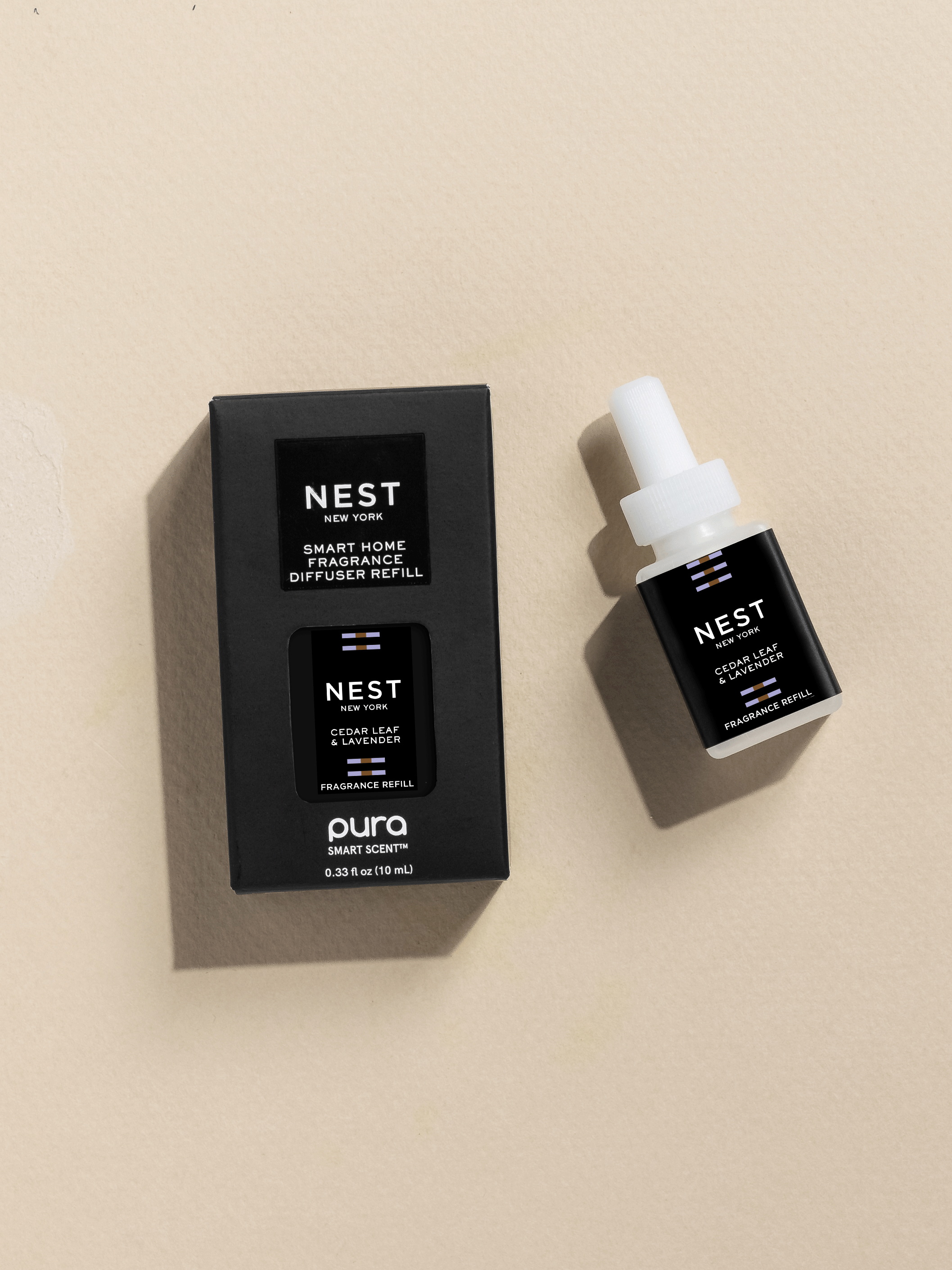 NEST New York Cedar Leaf and Lavender fragrance vial and packaging on a beige background
