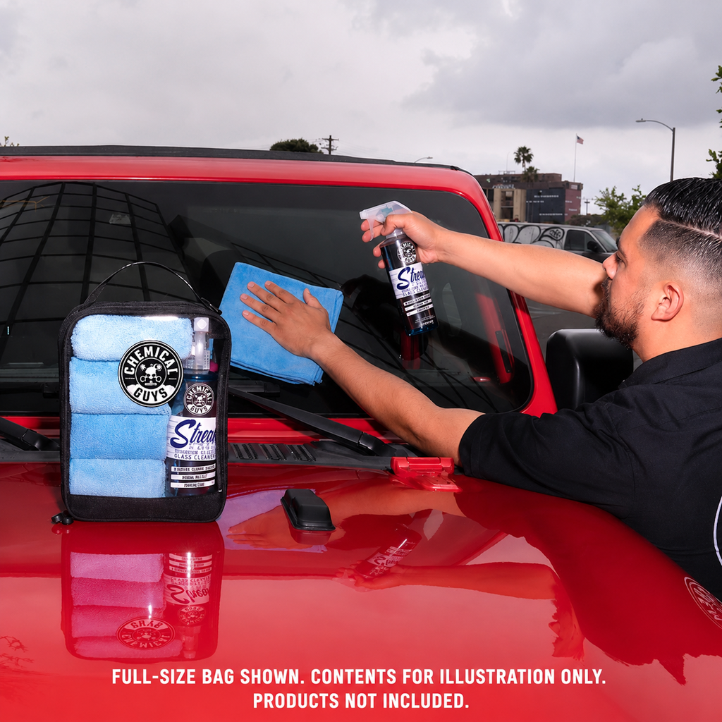 Man wiping windshield with Clear Carry Zippered Storage Bag on truck hood holding folded microfiber towels - full-size bag shown, contents for illustration only, products not included