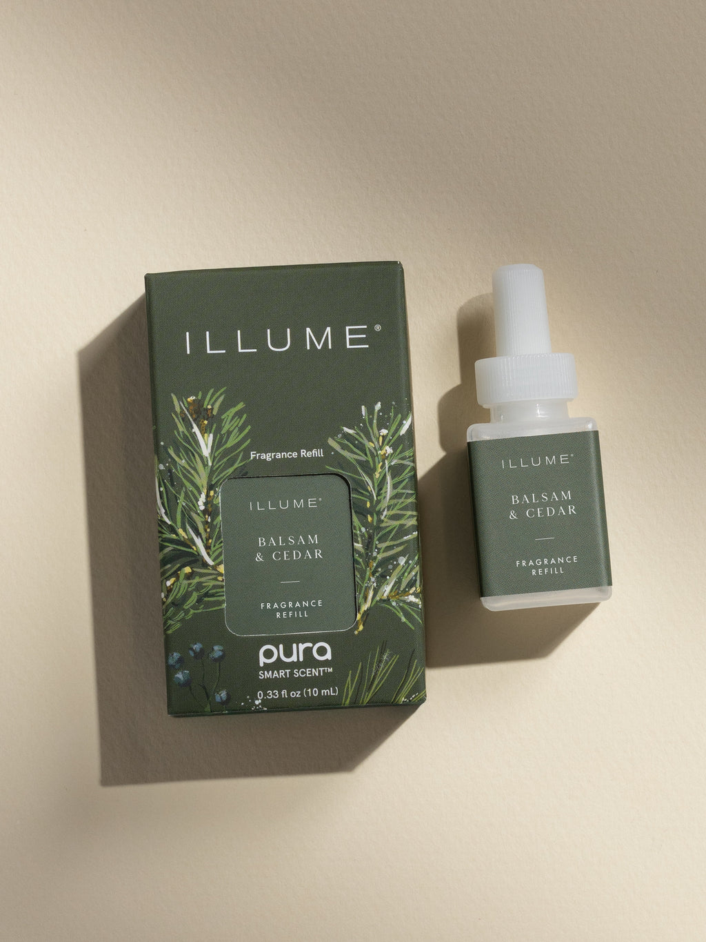ILLUME Balsam and Cedar fragrance vial and packaging on a neutral background