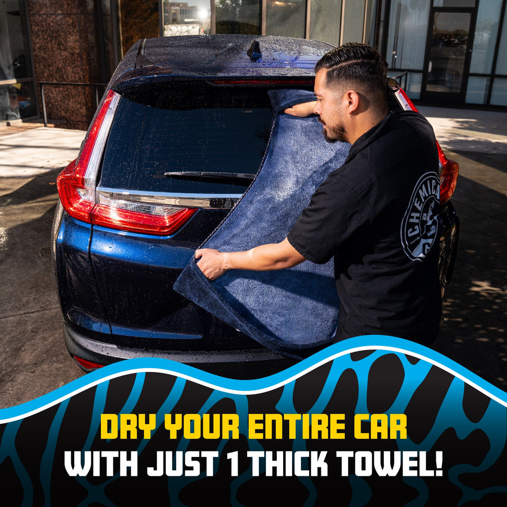 Man drying blue SUV trunk with Megalodon Pocket Grip towel - dry your entire car with just 1 thick towel