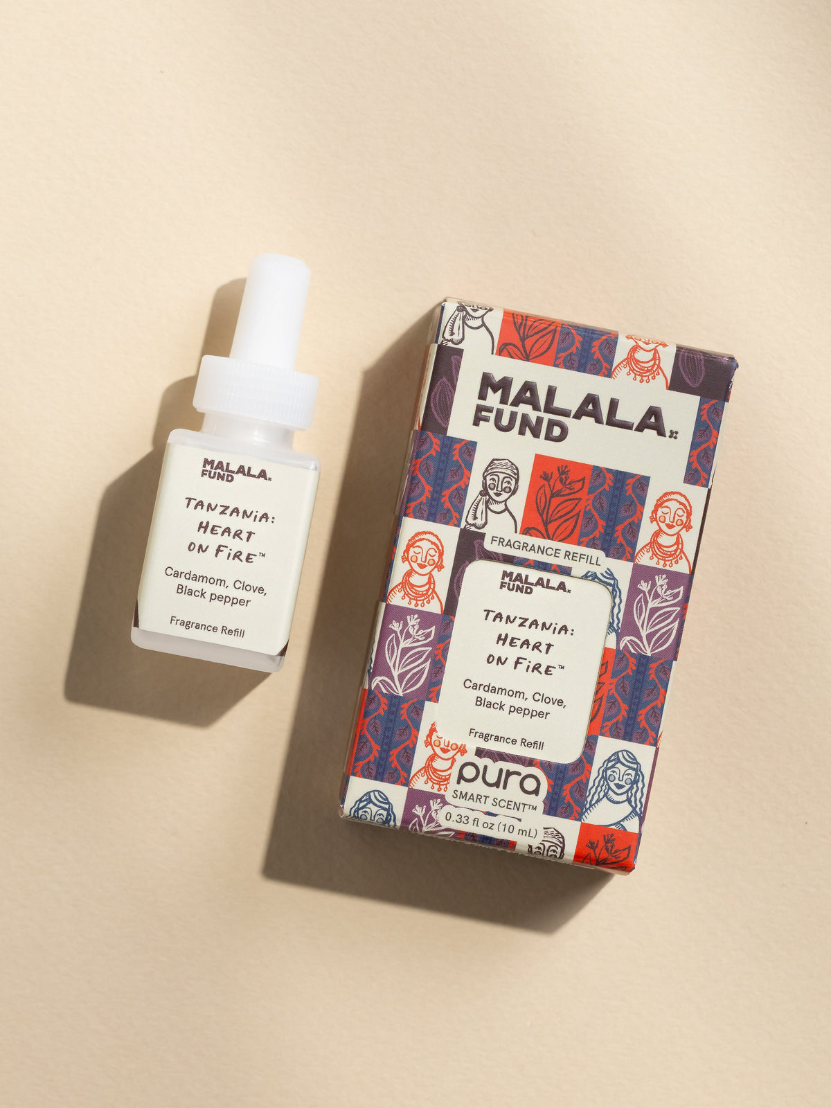 Malala Fund Tanzania Heart on Fire fragrance vial and packaging on a beige background