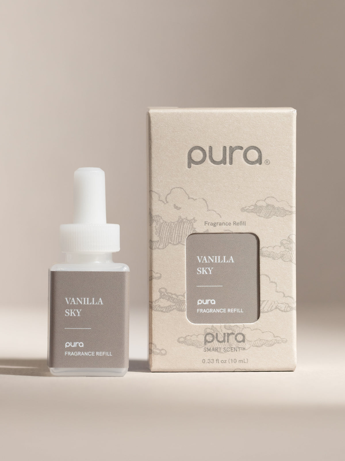 Pura Vanilla Sky fragrance vial and packaging on a beige background