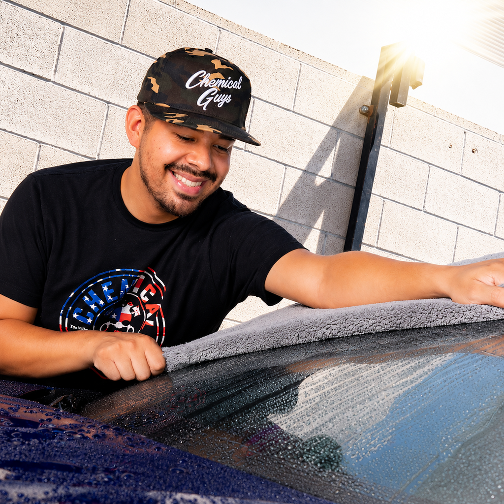 Snap-It-Back Camo Script Hat worn while drying a car